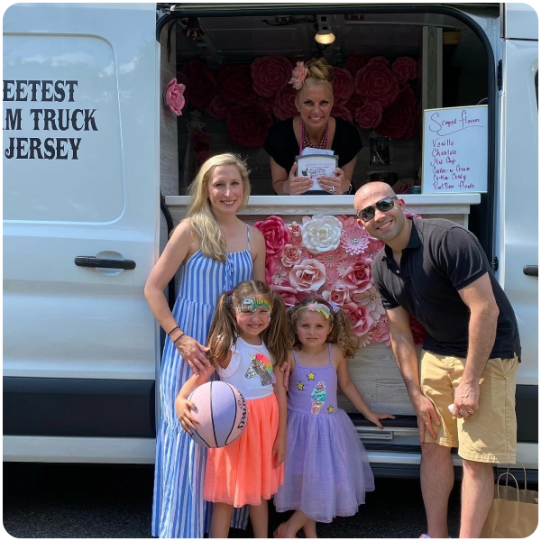 parent and children front of ice cream truck